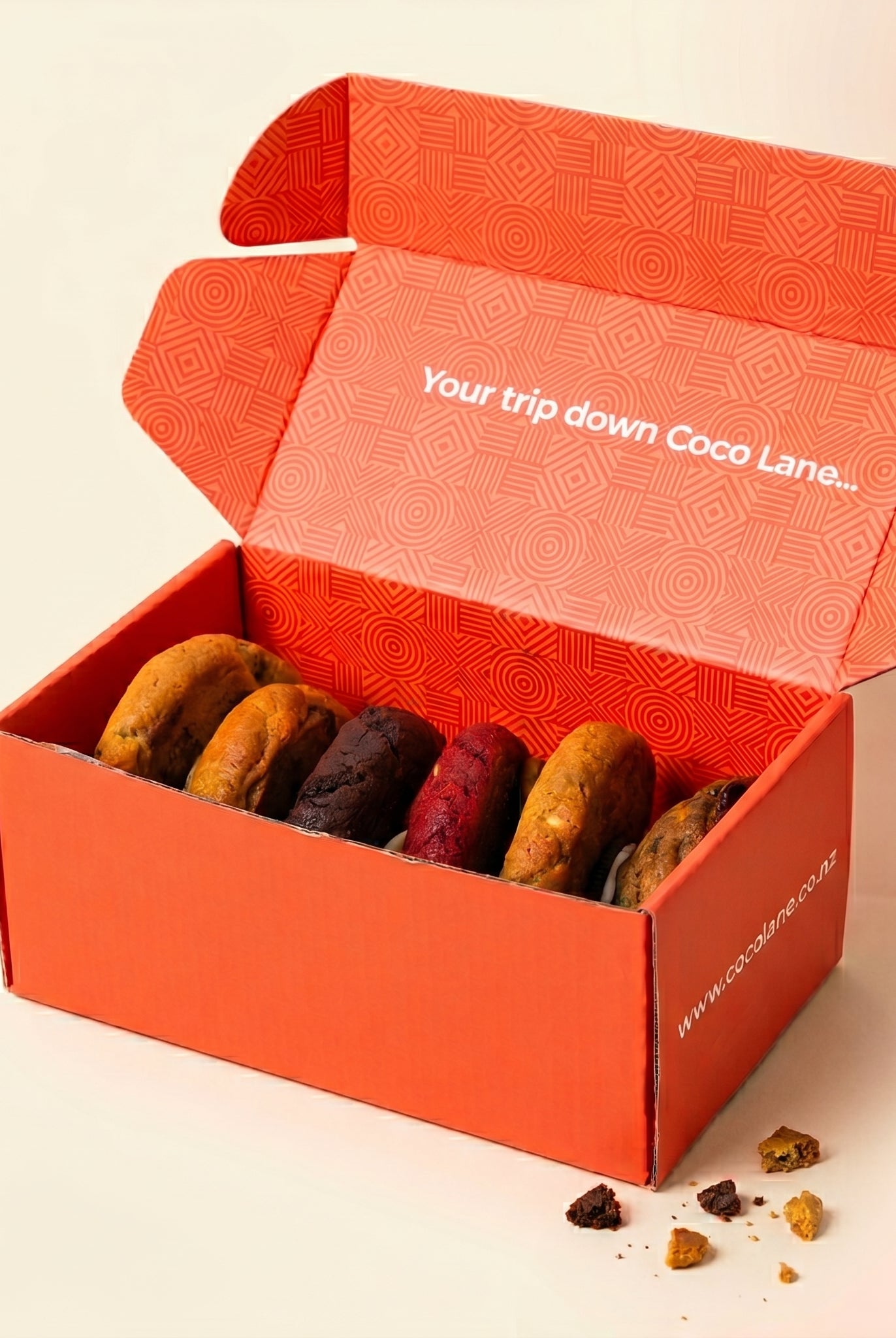 The Six Pack — six loaded cookies in the Coco Lane box, studio shot