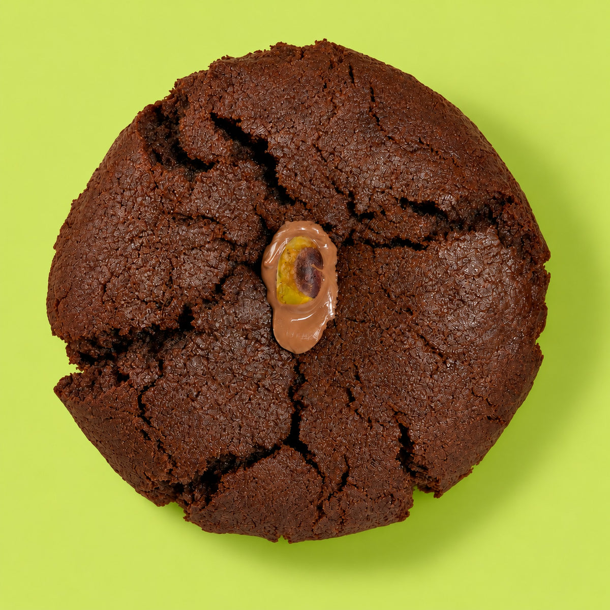 The Dubai Cookie by Coco Lane, dark chocolate with a milk chocolate dollop and a pistachio on top