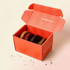 The Four Pack — four loaded cookies in the Coco Lane box, studio shot